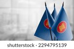 Small flags of the ASEAN on an abstract blurry background.