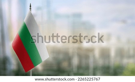 Small flags of the Bulgaria on an abstract blurry background.