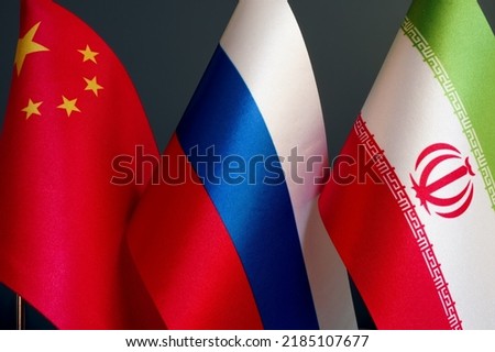 Small flags of China, Russia and Iran.