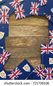 small flags framing a wood texture background with copy space