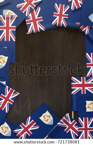 small flags framing a wood texture background with copy space