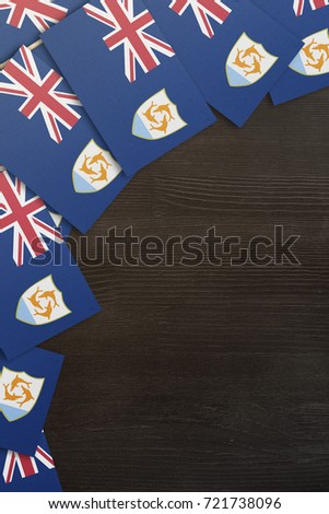 small flags framing a wood texture background with copy space