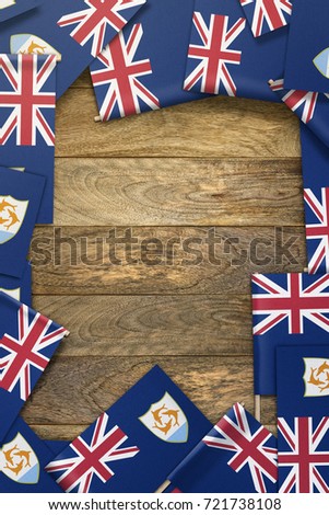 small flags framing a wood texture background with copy space