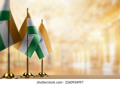 Small flags of the India on an abstract blurry background. - Shutterstock ID 2260934997