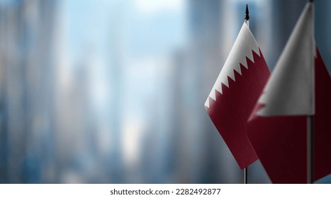 Small flags of the Qatar on an abstract blurry background. - Shutterstock ID 2282492877