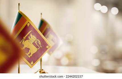 Small flags of the Sri Lanka on an abstract blurry background. - Shutterstock ID 2244202157