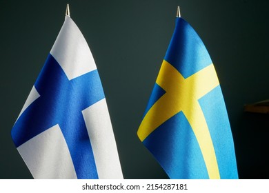 The small flags of Sweden and Finland.