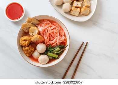 small flat rice noodles with fish balls and shrimp balls in pink soup, Yen Ta Four or Yen Ta Fo - Asian food style - Shutterstock ID 2283023859