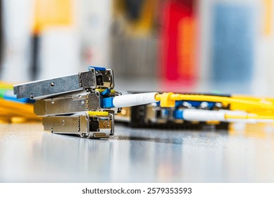 Small Form-Factor Pluggable with Fiber Optic Cable Used for Telecommunication and Data Communications Applications - Powered by Shutterstock - Get 15% off with code: PIKWIZARD15
