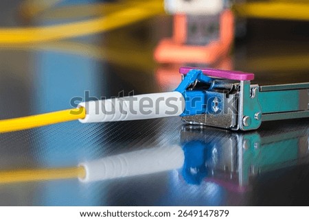 Small Form-Factor Pluggable with Fiber Optic Cable Used for Telecommunication and Data Communications Applications