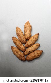 small French baguettes lying in the shape of ear of wheat on gray background flat lay. Image contains copy space - Shutterstock ID 2209198415