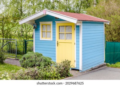 Small Garden Shed Or Tool Shed With Yellow Door