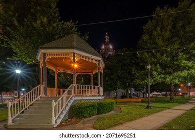 A Small Gazebo In The Park At Night