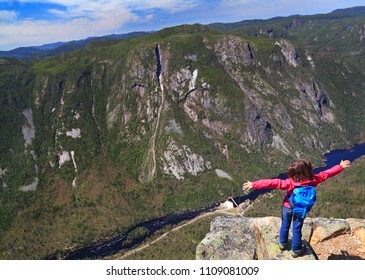 Small Girl Admiring The Landscape Of Malbaie Canyon And River From The Summit Of Acropoles Des Draveures, Hautes-Gorges-de-la-Rivière-Malbaie National Park In Quebec, Canada