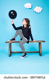 Small girl in a beautiful style fashion clothes collection of dress cute shoes happy birthday celebration, funny party kids, dance smile hug daughter sisters children seat on bench clouds sky love is