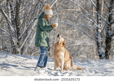 Small Girl With Golden Retriever Plays With Snow In Winter Forest - Powered by Shutterstock