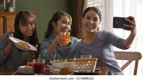 Small Girl Group Party Asia People Busy Talk Smile Eat Brunch Food Drink. Young Woman Fun Happy Hour Meal Shoot Photo Of Dish Plate Salad Bowl On Table Post Ig Reel Story App In Vegan Cafe Bar Shop.