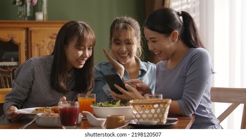 Small girl group party asia people busy talk smile eat brunch food drink. Young woman fun happy hour meal shoot photo of dish plate salad bowl on table post ig reel story app in vegan cafe bar shop. - Powered by Shutterstock