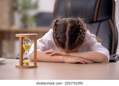 Small girl sitting in the classroom in time management concept - Shutterstock ID 2251731395