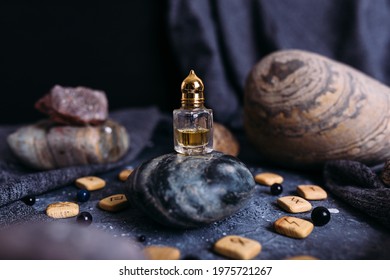 Small glass bottle with natural magic oil. Cosmetic and magic elixir.
