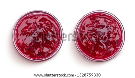 Small glass bowl of red berry jam isolated on white background, sweet cherry jam, top view 商業照片 © 