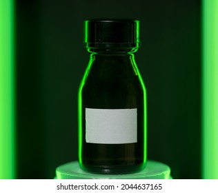 Small Glass Container. Neon Green Edged Silhouette. White Label For Mockup. Technological Or Futuristic Remedy.