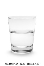 Small Glass Of Water Half Full Isolated On White Background.