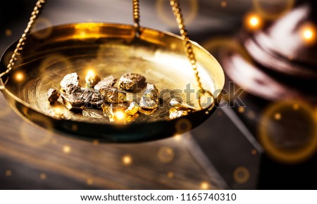 Small gold nuggets in an antique measuring