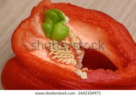 Small green pepper grows inside a large red pepper, internal proliferation