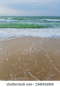 Small Green Wave Curling On Sandy New England Beach