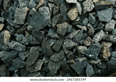the small  grey breakstone in backyard