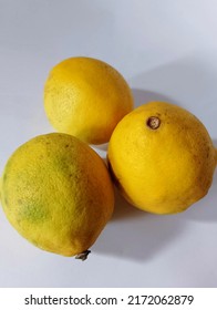 A Small Group Of Lemons Isolated On The White Backgrounds