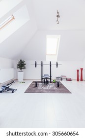 Small Gym Arranged In White Room At Home
