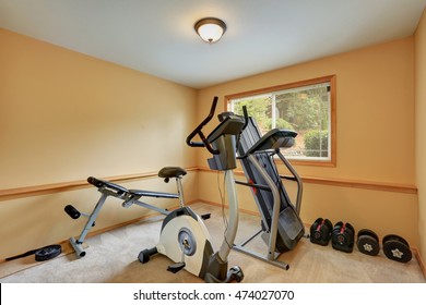 Small Gym Room With Exercise Equipments. House Interior. Northwest, USA