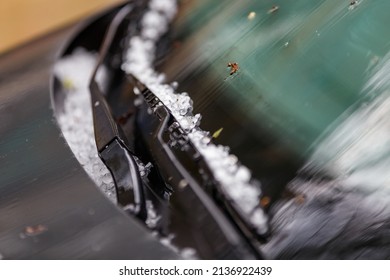 Small Hail Ice Balls On Black Car Hood After Heavy Summer Storm Close-up With Selective Focus At Daylight.