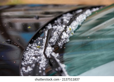 Small Hail Ice Balls On Black Car Hood After Heavy Summer Storm Close-up With Selective Focus At Daylight.