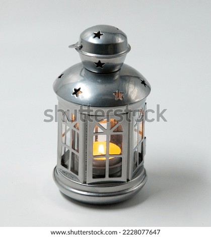A small hanging Islamic Arabic lantern fanos for Ramadan and Eid