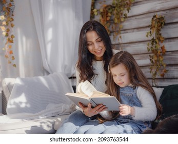 Small Happy Family Celebrating Thanksgiving. Cute Funny Toddler. Harvesting Gifts Autumn. Countryside Lifestyle. Parenthood Small Moments, Read Interesting Book