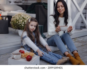 Small Happy Family Celebrating Thanksgiving. Cute Funny Toddler. Harvesting Gifts Autumn. Countryside Lifestyle. Parenthood Small Moments, Mom And Daughter Taste Hot Cocoa