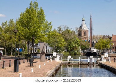 Small harbor in the center of the city of Meppel with a view of the church tower.
