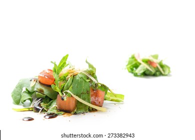 Small Heaps Of Rucola Salad With Tomatoes, Parmesan Cheese And Balsamic Vinegar As A Healthy Appetizer, Isolated On White Background