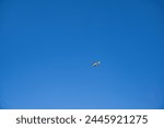 small helicopter on sky background