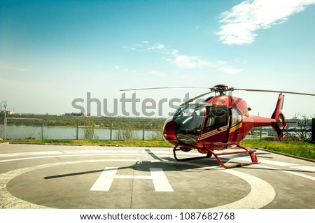Small helicopter parked at the helipad. Luxury lifestyle