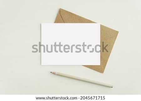 Small horizontal A6 size note card mockup for design presentation, postcard, greeting card mock up with envelope and pencil.