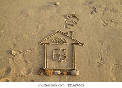 Small House Drawn On Wet Sand