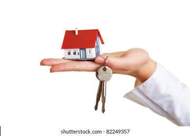 Small House And Keys On Palm Of Hand