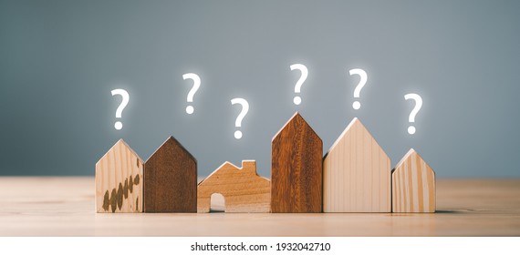 Small House Model With Question Marks, Planning To Buy Property. Choose What's The Best. A Symbol For Construction ,ecology, Loan Concepts.