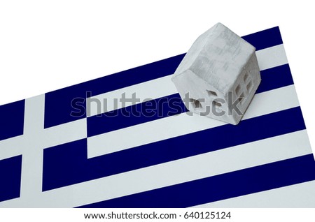Small house on a flag - Living or migrating to Greece
