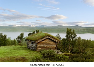 Small House On A Hill At The Norway Mountains.