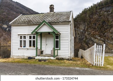 A Small House On The Shore Of The Fjord In Norway